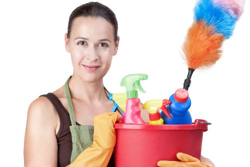 Carpet cleaning technician preparing equipment safely