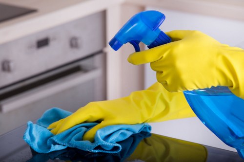 Local office cleaning team sanitising desks and shared surfaces in Ruislip